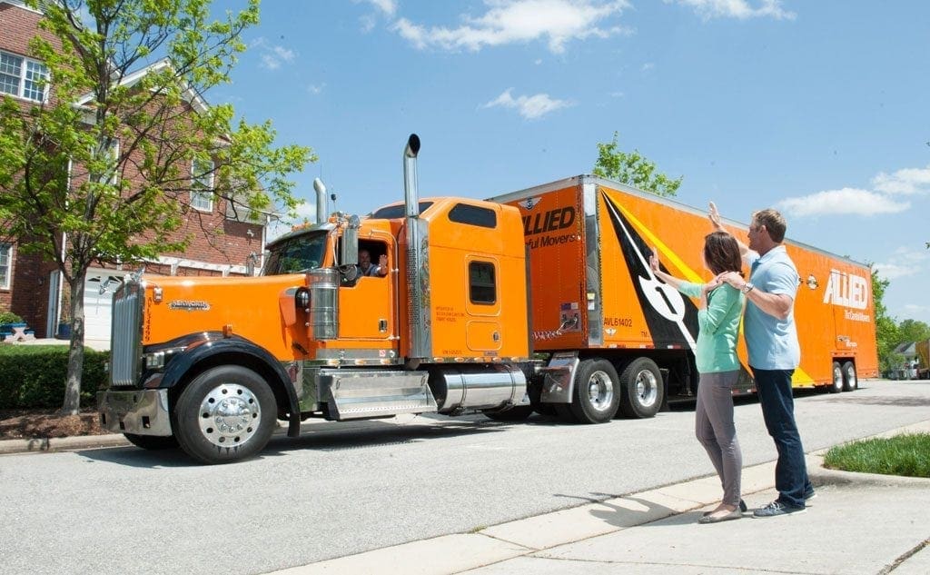 Couple Waving at Allied Van Lines Truck - North Western Warehouse